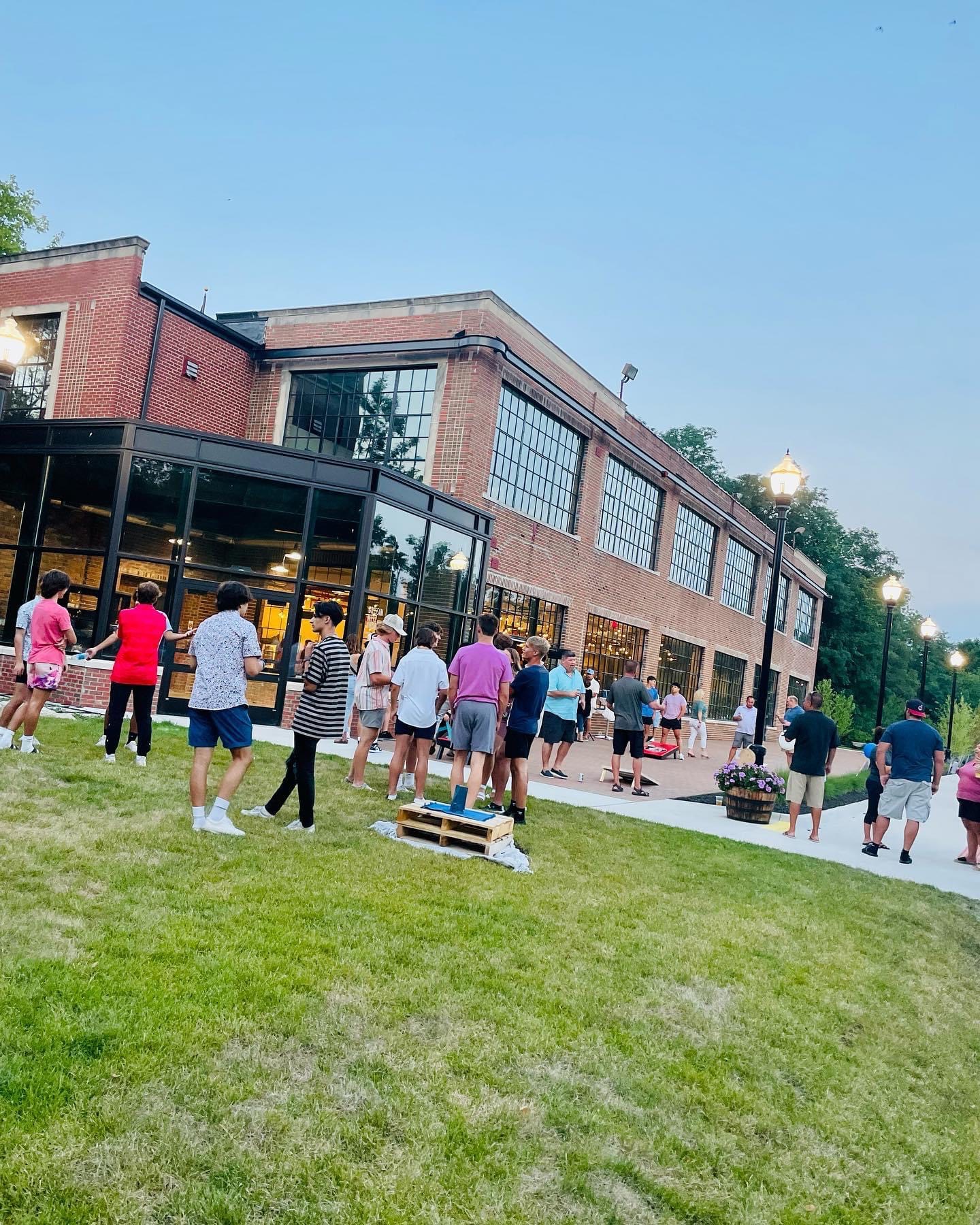 Open air social event in front of building